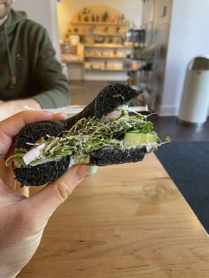 “Plain” charcoal veggie bagel at Rooted Juicery + Kitchen - Downtown in Cincinnati