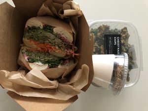 Beet hummus bagel, kale chips and coconut yogurt   at Rooted Juicery + Kitchen - Downtown in Cincinnati