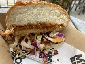 Delicious schnitzel but oversized bun at MooFree Burgers - Food Truck in Morningside