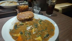 Vege curry with soy bean burger, 400g rice, vegetables and spinach. at Coco Ichibanya in Hiroshima