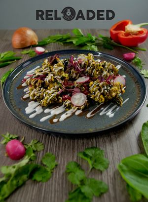Starter: Patta Chaat 
Kale in crispy chickpea batter, served with Greek yogurt (or vegan spiced mayo), tamarind chutney, mango chutney, chaat masala & pomegranate seeds 
 at Indi-Yang in Torquay