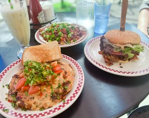 The Vegan Mess, vegan chili cheese fries, and seitan devil burger with a soy banana shake  at St Francis Fountain and Candy in San Francisco