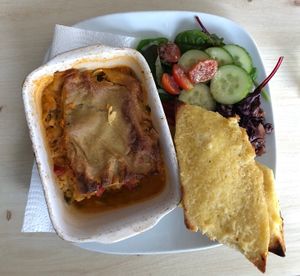 The lasagne with garlic bread and some kimchi to try 😀  at Vega in Tintagel