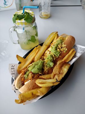 Chilli dog with guacamole, tortilla crumble and chips at Papagayo in Torremolinos