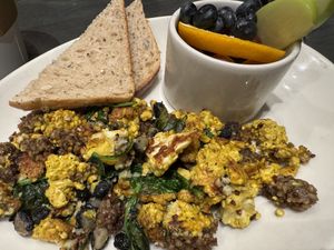 Bee-spoke scramble with v goetta, tofu scramble and added spinach, back beans and garlic herb!  at Sleepy Bee Cafe - Downtown in Cincinnati