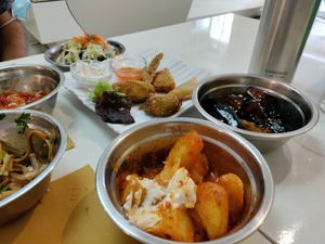 Patatas bravas, eggplant and fried bites to share at Loving Hut in Valencia