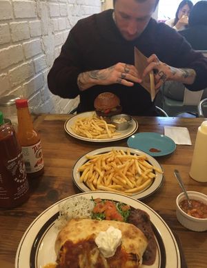 Me with my veggie burger. Also veggie enchilada! at EvilTex in Takayama