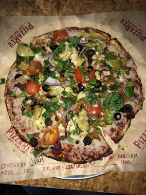 Vegan pizza w/ all the veggies, vegan cheese, vegan sausage  at PizzaRev in Sioux Falls