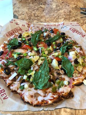 Extra vegan cheese kind of day. Tuesday is $6.95 pizza! at PizzaRev in Sioux Falls