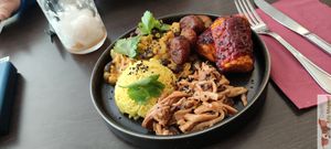 Bowl of Curry of coral lentils, chickpeas and red beans, turmeric rice, banana plantins, eryngii spicy cajun sauce at Annie's Kitchen in Lille