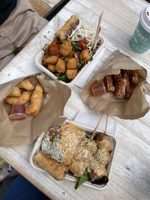 Prawn rolls, bean curd rolls, satay chicken skewers and pad see ew.  at Plant Based Eatery - Food Stand in Wollongong
