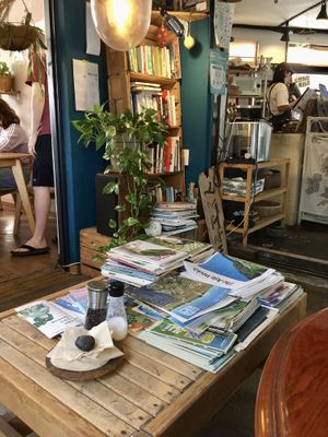 Cozy seating with vegan literature   at And 유 (Yu) Cafe in Jeju