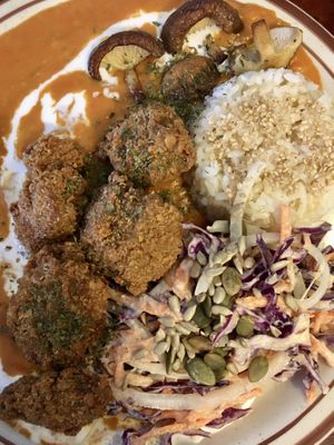 Vegan chicken curry made with crispy seitan and perfectly cooked mushrooms. Served with rice and slaw.  at And 유 (Yu) Cafe in Jeju