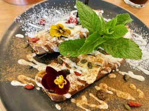 Caramelized Sweet potato with yoghurt, cinnamon, goji berries, pumpkin seeds and some chocolate   at That's Toast in Bruges