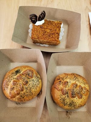 Two vegan beef and cheese piroshkis and vegan honey cake at Pinoyshki in Seattle