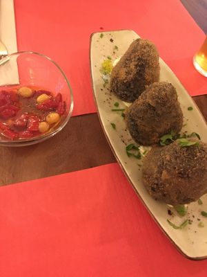 Creative and delicious black rice arancinis (a little too salty) at La Tia Carlota in Madrid