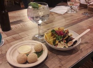 Nachobowl and sweet sesame balls at Foodhallen in Amsterdam