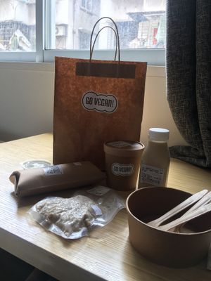 Tempeh burrito with guacamole, green curry with brown rice & almond milk.  at Go Vegan! Grab N Go in Guangzhou