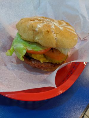 Beyond burger with vegan cheese, lettuce, pickles, tomato at A Slice of Heaven in Wareham