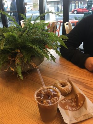 Orange blossom donut, cold brew with oat milk, and ambience. at Mighty-O Donuts - Denny Triangle in Seattle