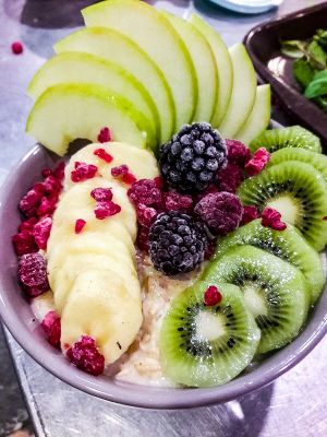 Creamy Oatmeal porridge - fresh seasonal fruits and berries (nut milk option, coconut & almond)  at The Juice Lounge in Antalya