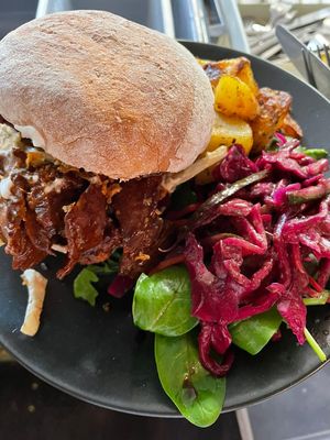 Pulled Pork Ciabatta - house made seiten with BBQ sauce, cajun slaw & crispy onions! at Hunter Gatherer in Portsmouth