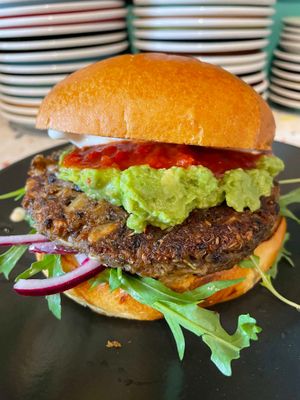 Cali Burger - Homemade quinoa & black bean patty, avocado, pickled red onion, garlic mayo, rocket on a toasted brioche bun! at Hunter Gatherer in Portsmouth