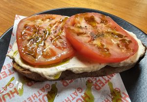 Sourdough with ricotta, huge tomatoes and basil oil at Hunter Gatherer in Portsmouth