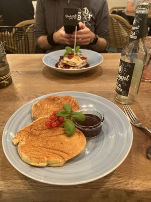 Upfront: Pancakes with Syrup. Rear: Pancakes with Berries  at Vrohstoff in Wurzburg