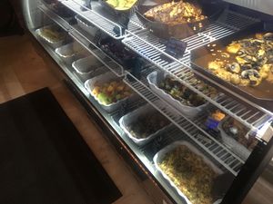 White containers in the deli case are vegan options  at Moonlight Cafe in Brewster