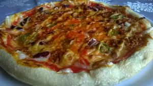 Vegan pizza Mexicano with vegan cheese, beans, jalapeno, soy pieces and vegan nacho cheese at Bullizza in Ljubljana