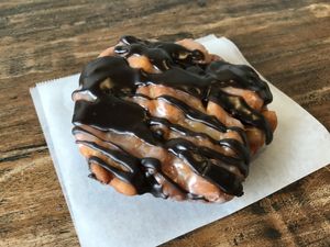 By special request... Apple fritter with chocolate drizzle. Incredible!  at Sweet Retreat Donuts in Long Beach