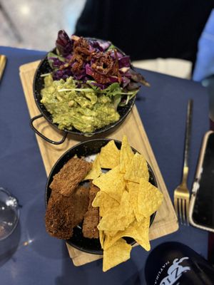 Guacamole with nachos and croutons  (vegan)  at Ziga in Verona