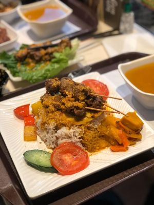 The. Fried. Egg. On. This nasi goreng type dish.  (Under the skewers)  at Loving Hut - Amoy Plaza in Kowloon