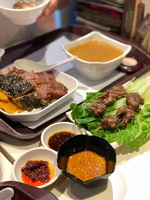 Lamb skewers, satay sauce, and Unagi fillet, char siu, pumpkin on rice  at Loving Hut - Amoy Plaza in Kowloon