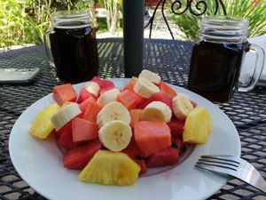 Large fruit plate and iced coffee at Casa de Cafe B&B in Copan Ruinas