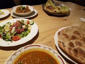 all vegan: komatsuna (Japanese mustard spinach) naan, another wheat bread, salad with "cheese" dressing, baingan bharta, soymeat curry  at Nataraj - Harajuku Omotesando in Tokyo