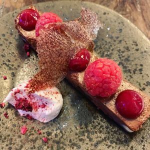 Tsokolate (dark chocolate mousse on a chocolate cookie with raspberry). at Pobrecito in Helsinki