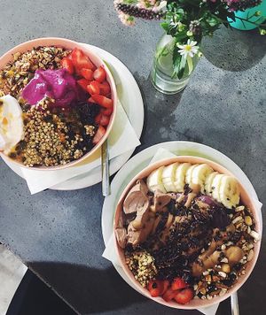 Pink pitaya bowl (coconut yoghurt) and peanut butter bowl  at Niche & Co in Tugun