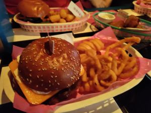 Fried chicken burger and curly fries at Evies Disco Diner in Fitzroy