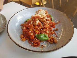 Spaghetti Al Pomodoro with chickpea ragu, crispy chickpeas and smoked tomato sugo at Mark & Vinny's Spaghetti & Spritz in Surry Hills