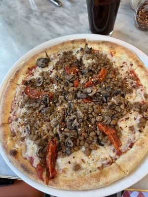 Add extra cheese if you love/loved cheesy pizza on the Vegan Pizza. It’s so good.  at Flour & Barley in Las Vegas