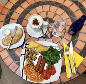 Vegan english breakfast with soy milk cappuccino at Mango Cafe in Mijas