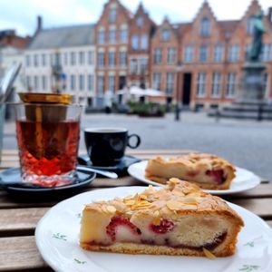 Tea, coffee and almond rasberry cake at Blackbird in Bruges