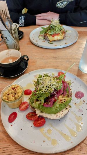 Toast Avocado (the best you'll ever eat in your life) a side of scrambled tofu and a delicious toast Kimchi 👌🏻 at Blackbird in Bruges