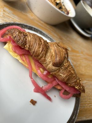 Croissant hamm & cheeze with pickled onion 6,90€
  at Blackbird in Bruges