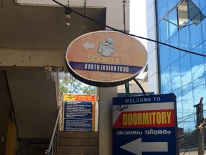 sign in alleyway at Sharma in Thiruvananthapuram
