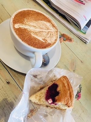 Almond and raspberry cake with chai tea at The Gratitude Cafe in Telford