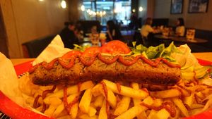 Currywürst,  Curry Ketchup, Saurcrougette and Fries. at Knaves Kitchen in Leeds