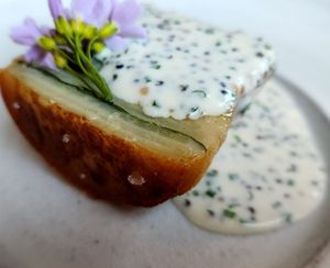 Layers of potatoes, herbs in the middle w/creamy horseradish sauce and land caviar at Ark in Copenhagen